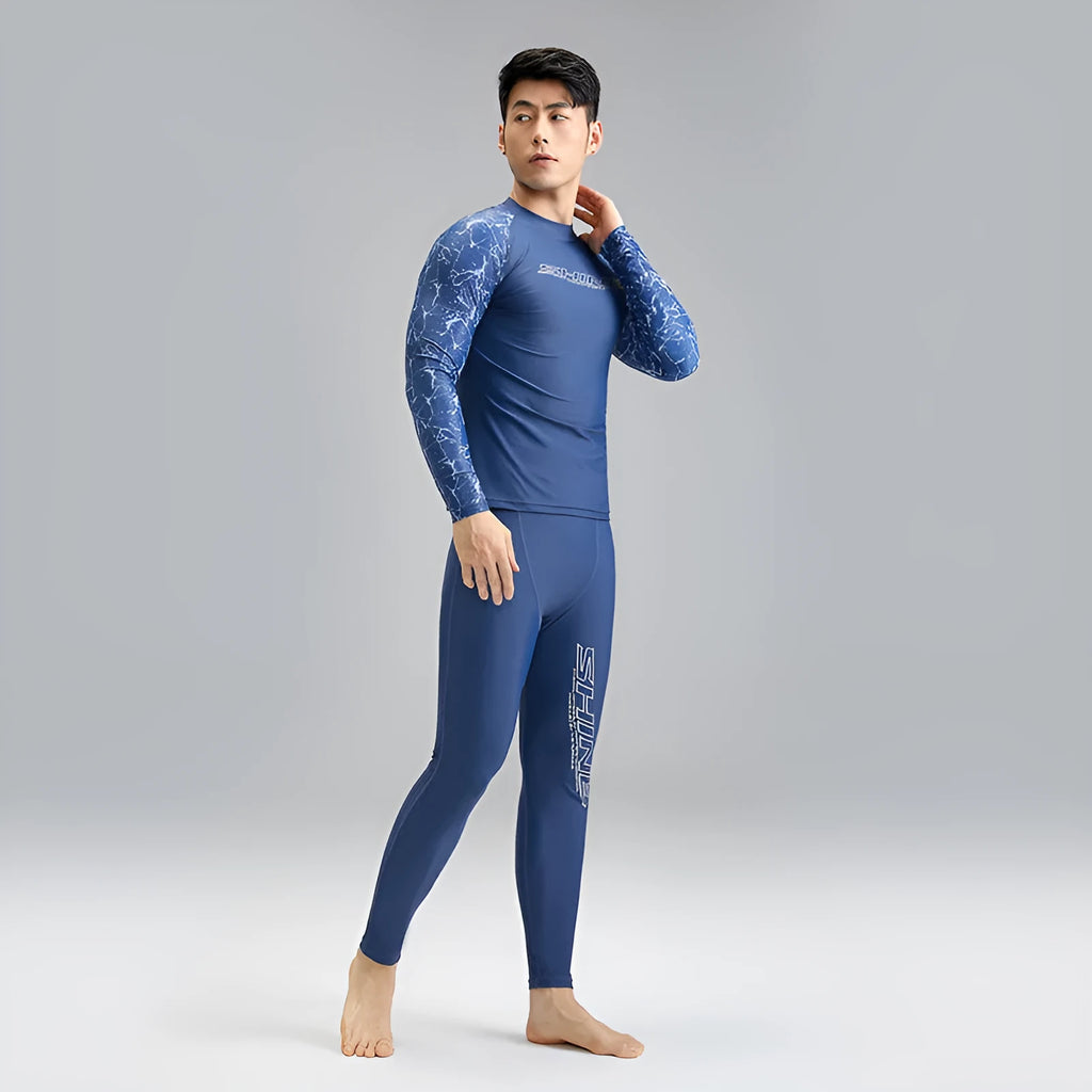 Men's dark blue patterned nylon swimwear set consisting of a top and trousers.