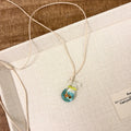 Women's necklace with a coloured glaze Skirt Everyday Joker pendant on a cotton and linen clavicle chain.