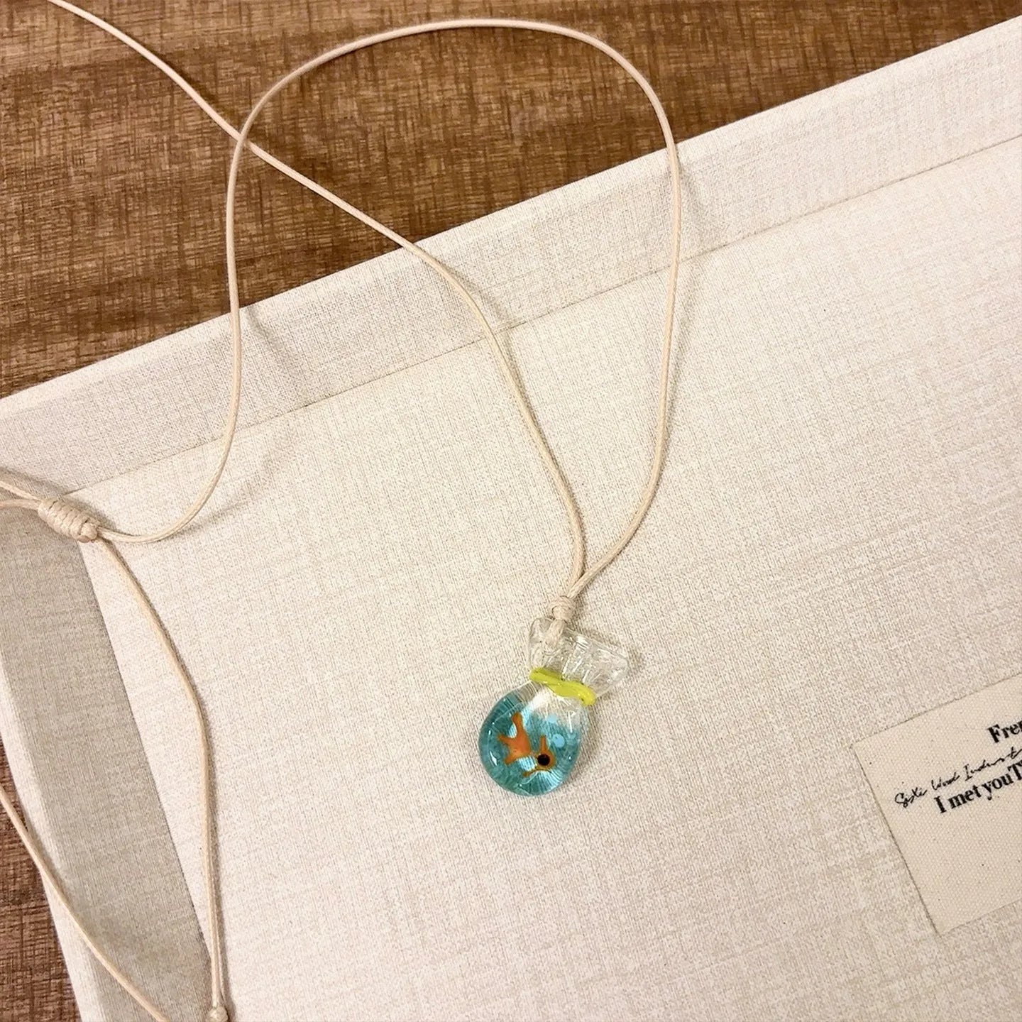 Women's necklace with a coloured glaze Skirt Everyday Joker pendant on a cotton and linen clavicle chain.
