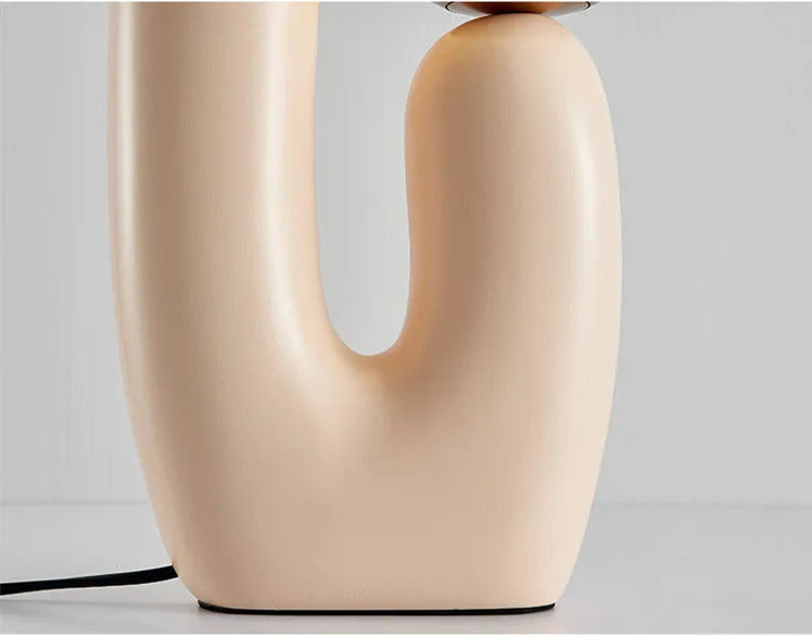 Pink double-head resin table lamp with glass shades on a bedside table, 49cm height