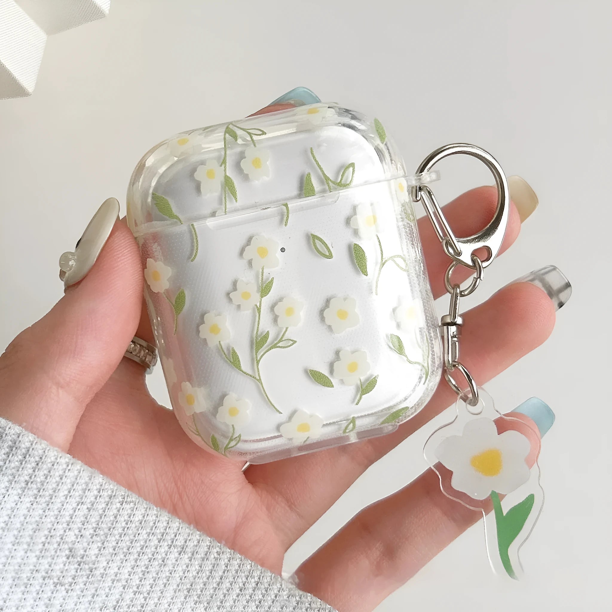 White transparent floral TPU protective cover for Apple AirPods showing decorative elements