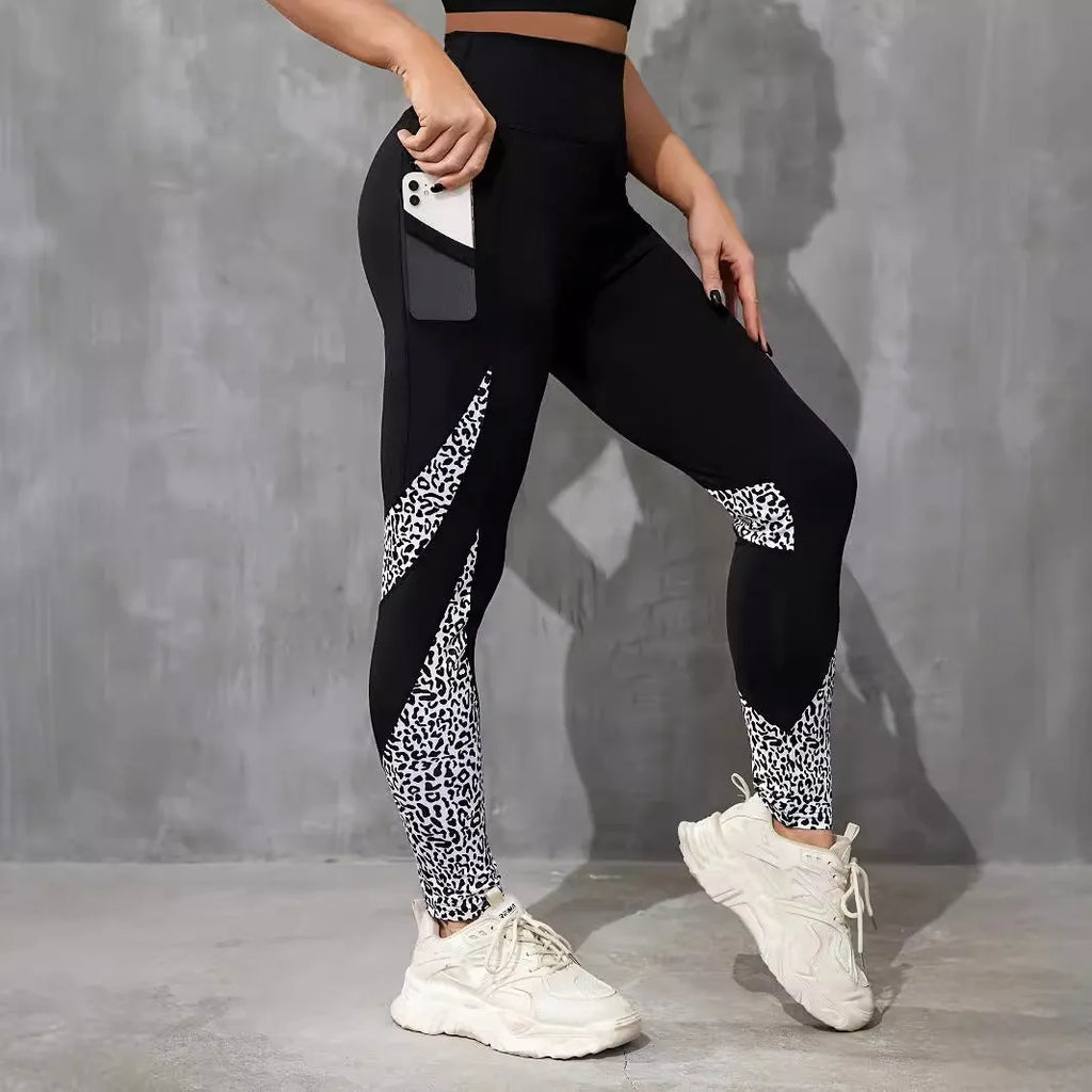 Women's black high-waisted cropped sports leggings with pocket detail and leopard print design