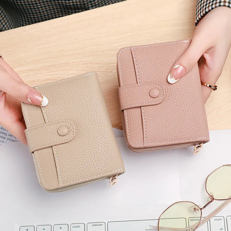 Ladies short wallet with lychee pattern in synthetic pu leather showing 2-fold design