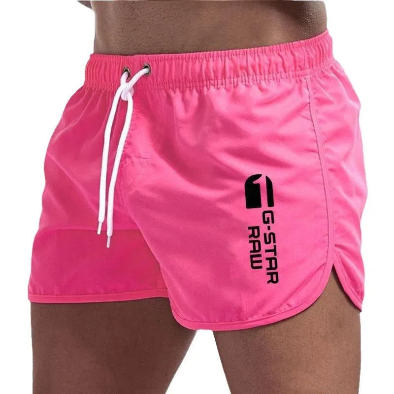 Man wearing lightweight polyester hemp-blended sports shorts in a vibrant colour with a micro-elastic waistband.