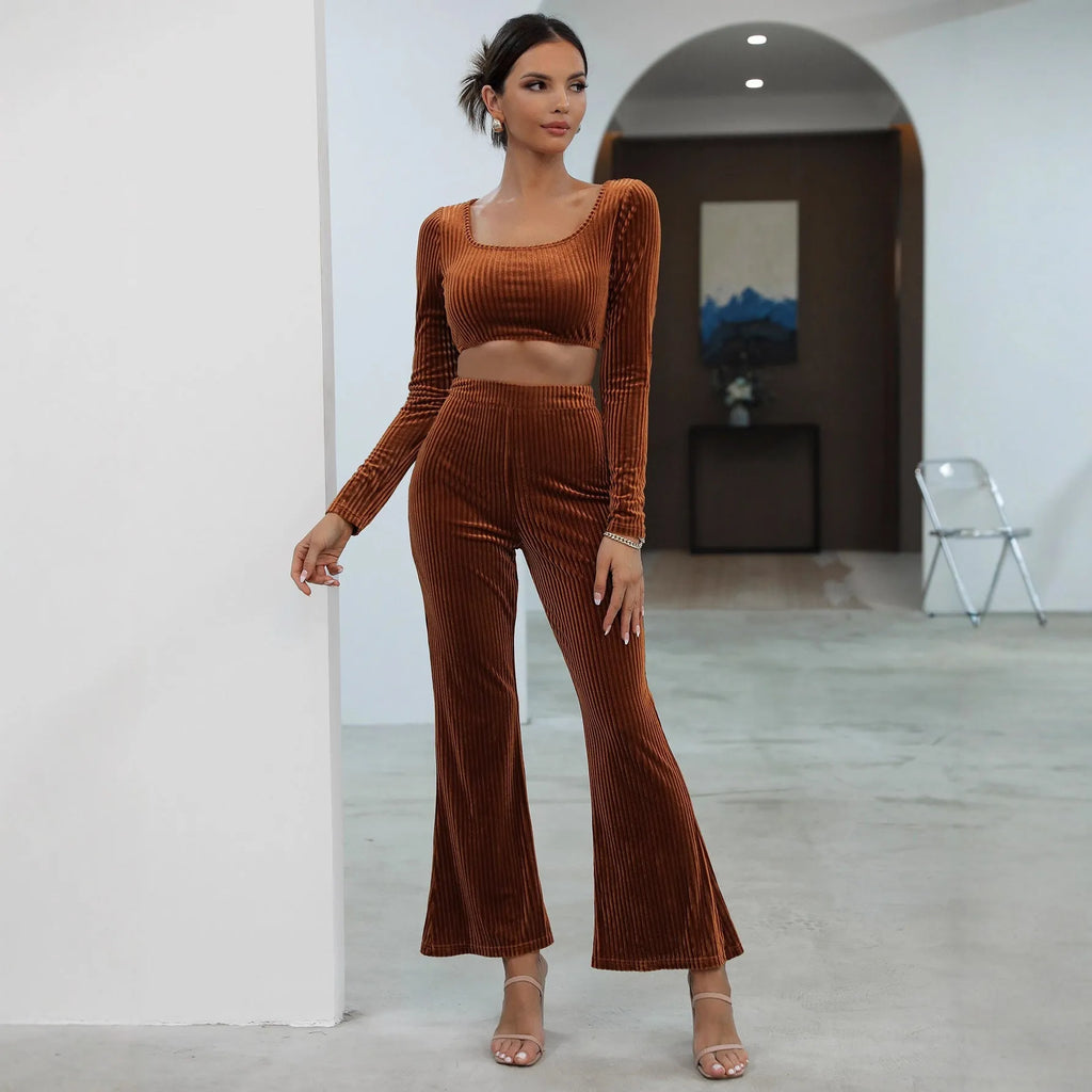 Caramel coloured long sleeve sweater and matching trousers casual set laid flat.