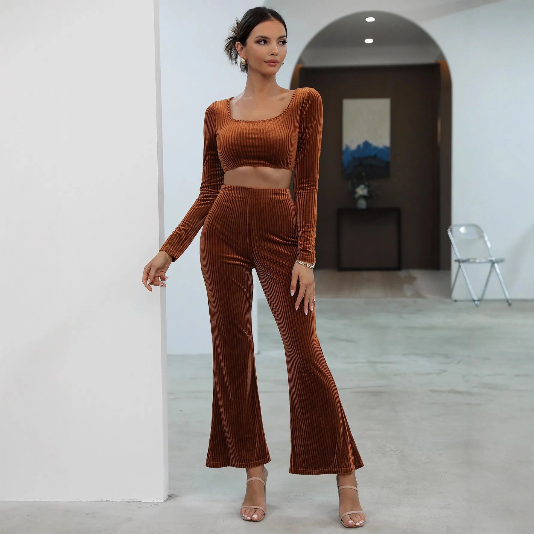 Caramel coloured long sleeve sweater and matching trousers casual set laid flat.
