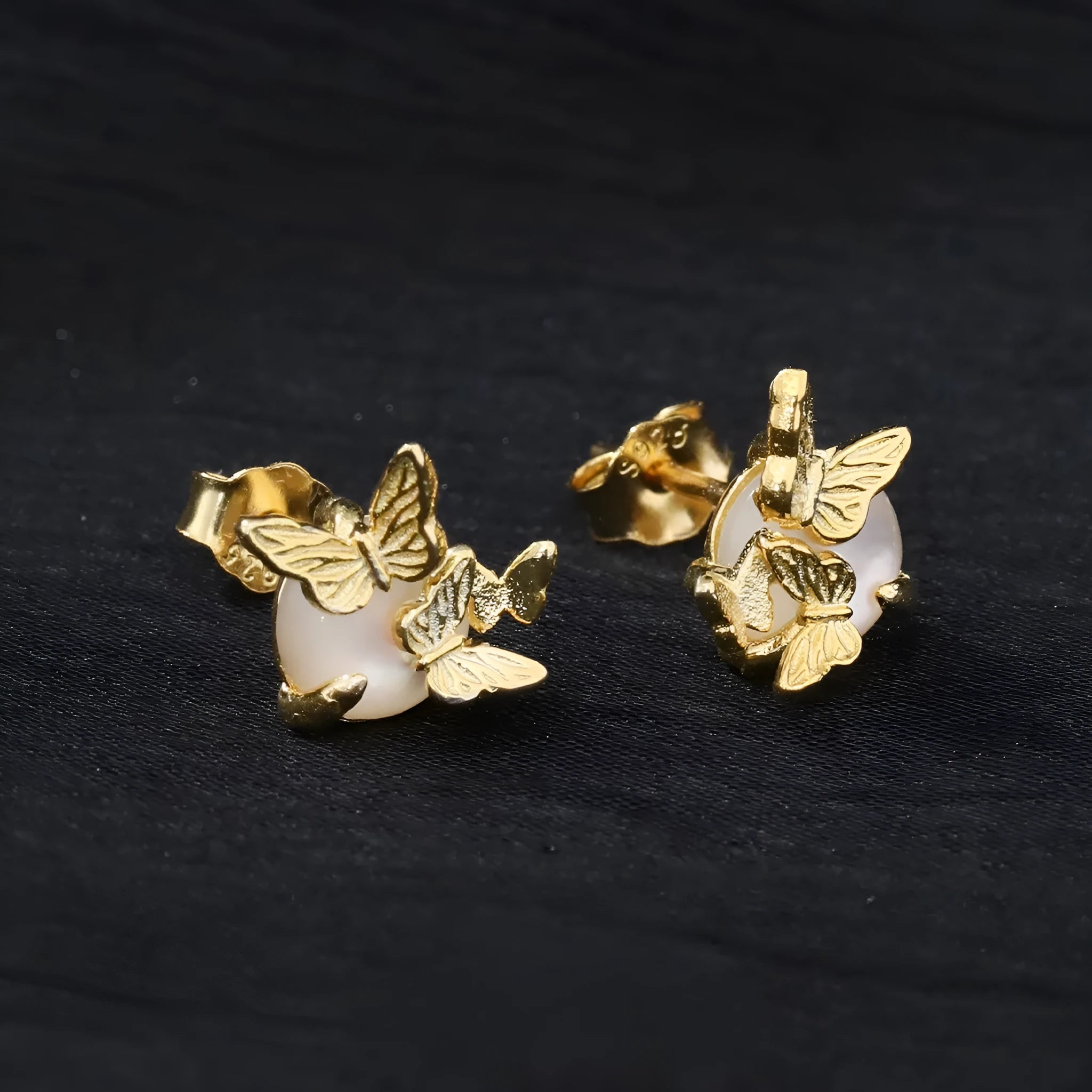 Original design butterfly ear studs in 925 silver with gold electroplated finish.