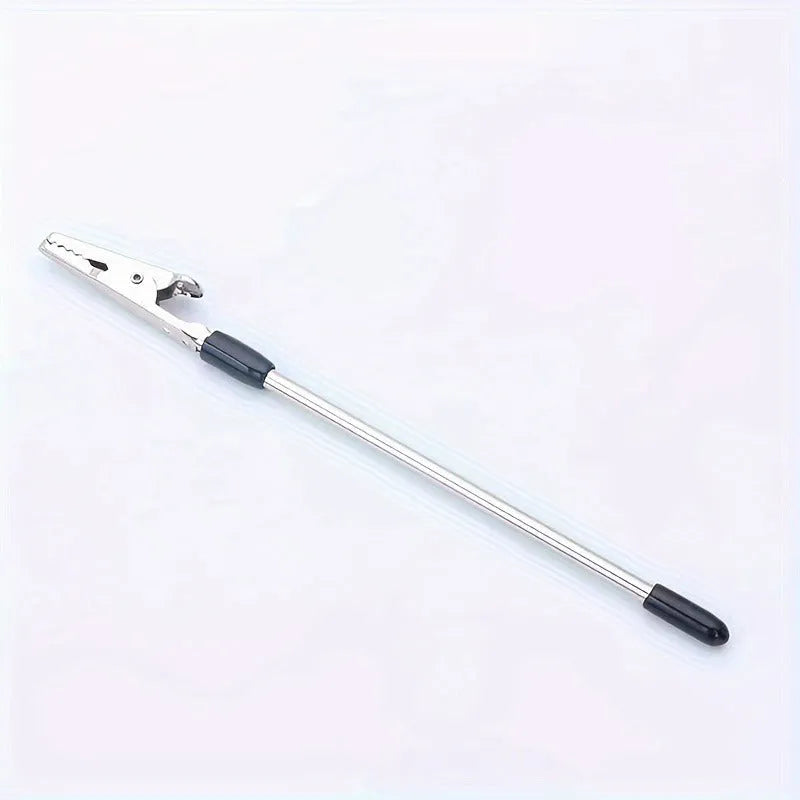 Gold-plated iron rod alligator clip note holder 155mm on a desk holding a paper note