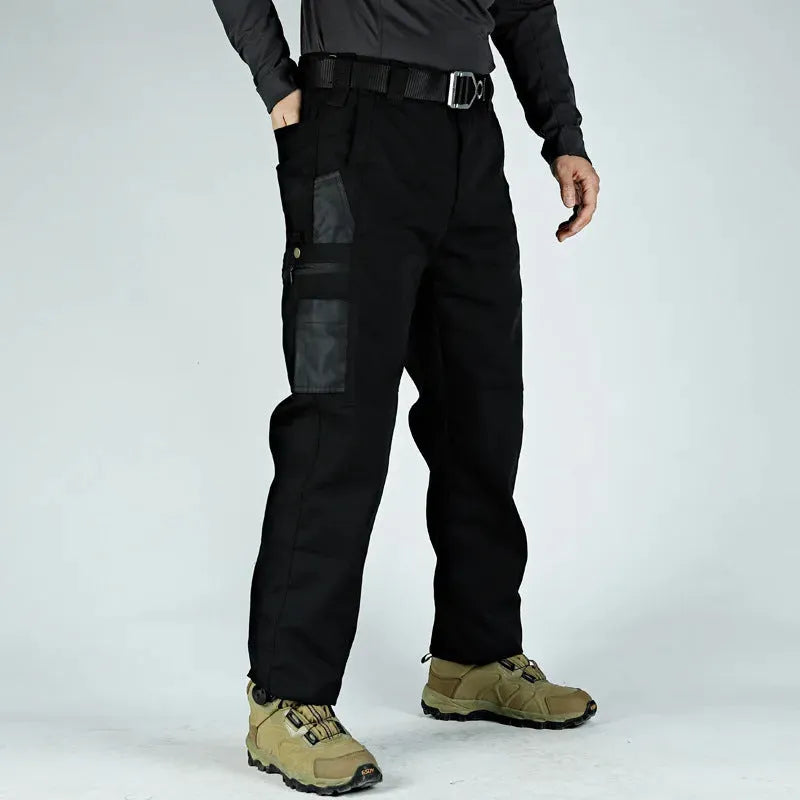 Men's multi-pocket water repellent outdoor trousers in army green, front view showing pockets and fabric texture