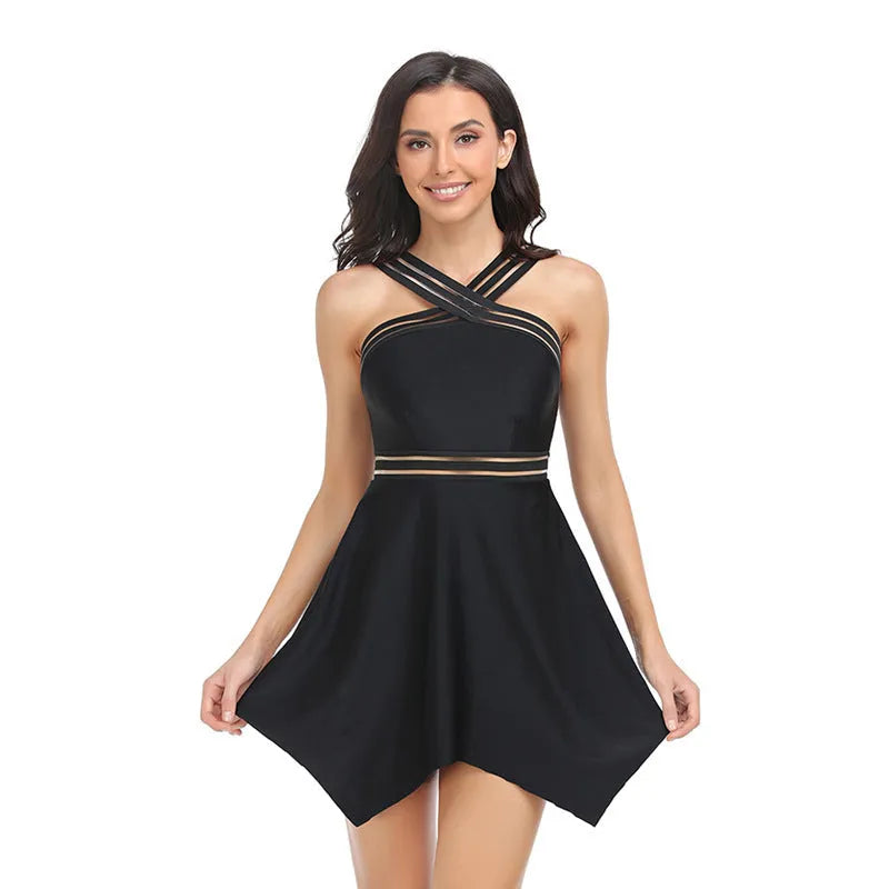 Women's one-piece swimsuit with a black tulle skirt overlay and split leg design on a mannequin.
