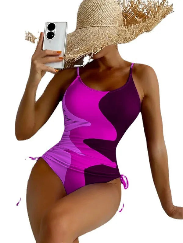 Women's blue one-piece sleeveless swimsuit with a backless design for swimming sports.
