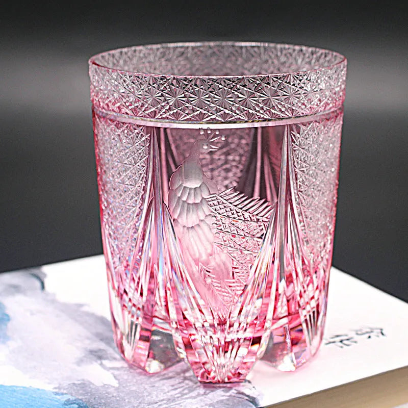 Crystal whiskey glass in simple style, colour Bluish Gray Fluorite, on a table