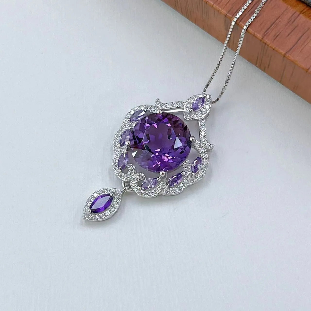 Purple amethyst stone set in silver U-shaped pendant with meteor shower pattern decoration