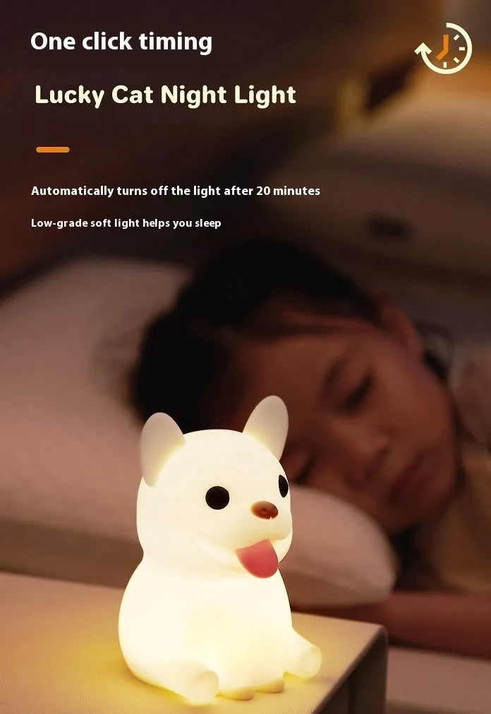 Cartoon animal silicone USB night light with dimmer switch on a bedside table.