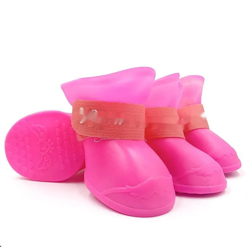 Set of four colourful rubber pet rain shoes with soft soles for dogs or cats.
