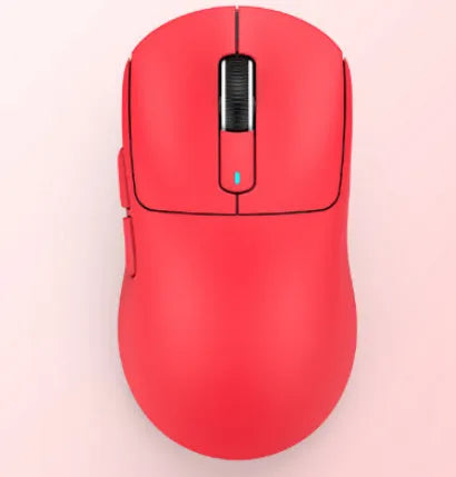 Black rechargeable Bluetooth mouse with USB receiver and coiled parachute cable on a desk.