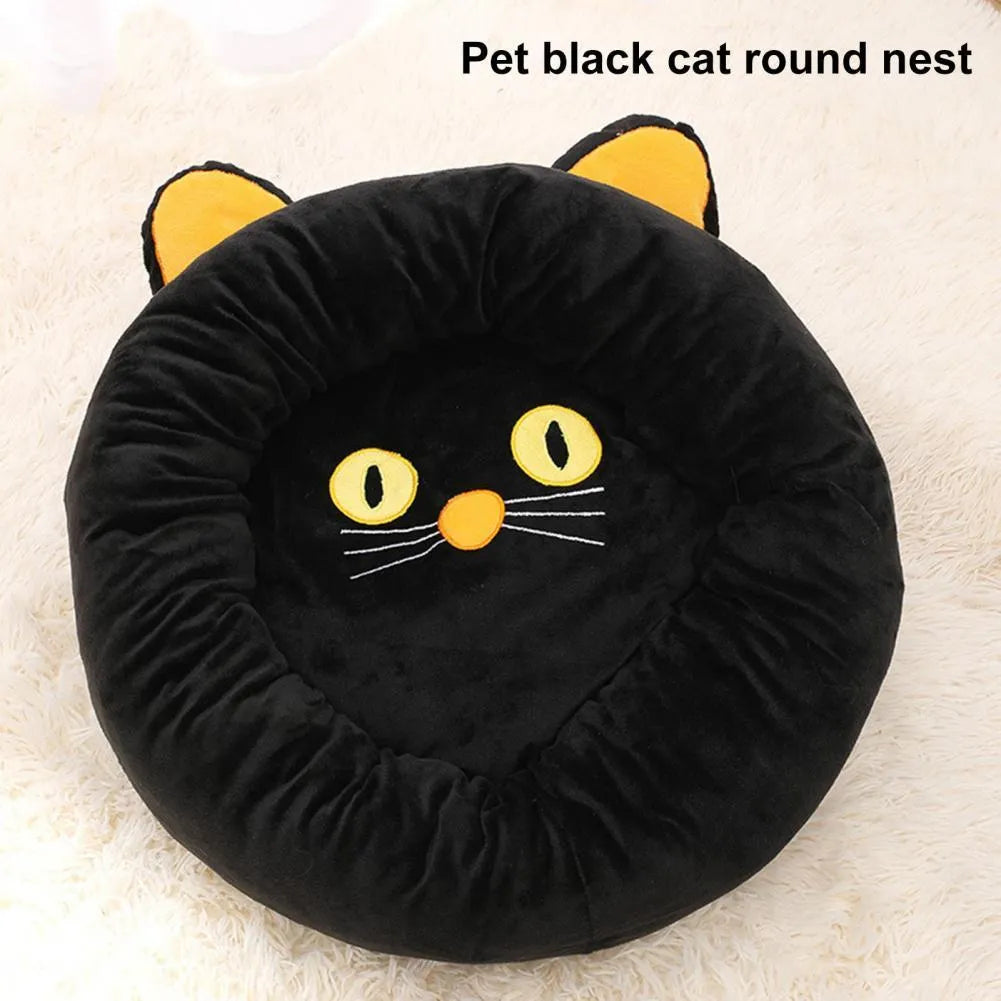 Black cat shaped velvet pet bed with raised edges for feline head and neck support