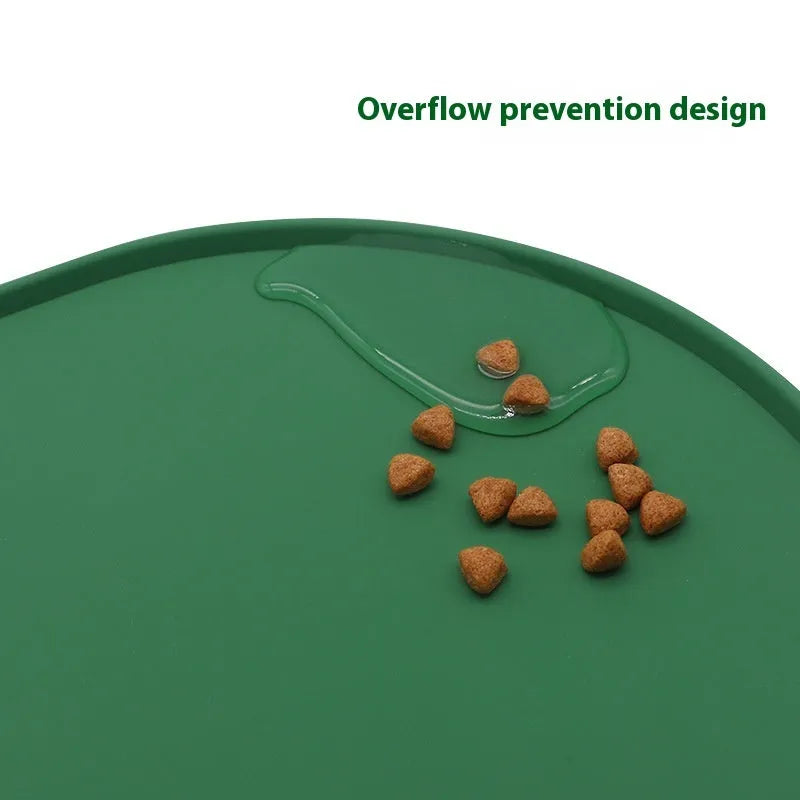 Green silicone waterproof cat feeding placemat with food bowl on it, showing non-slip textured surface.