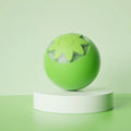 Green electric rolling ball pet toy for dogs and cats on a floor.