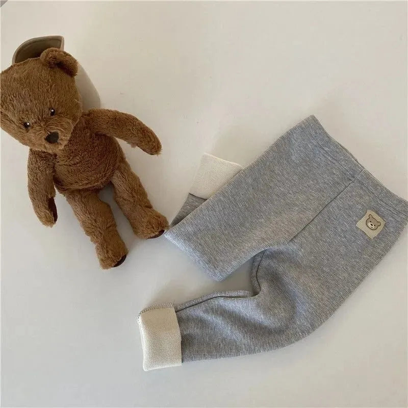 Girls' high-waisted fleece-lined leggings in beige, black, brown, and grey colours with a wool lining.