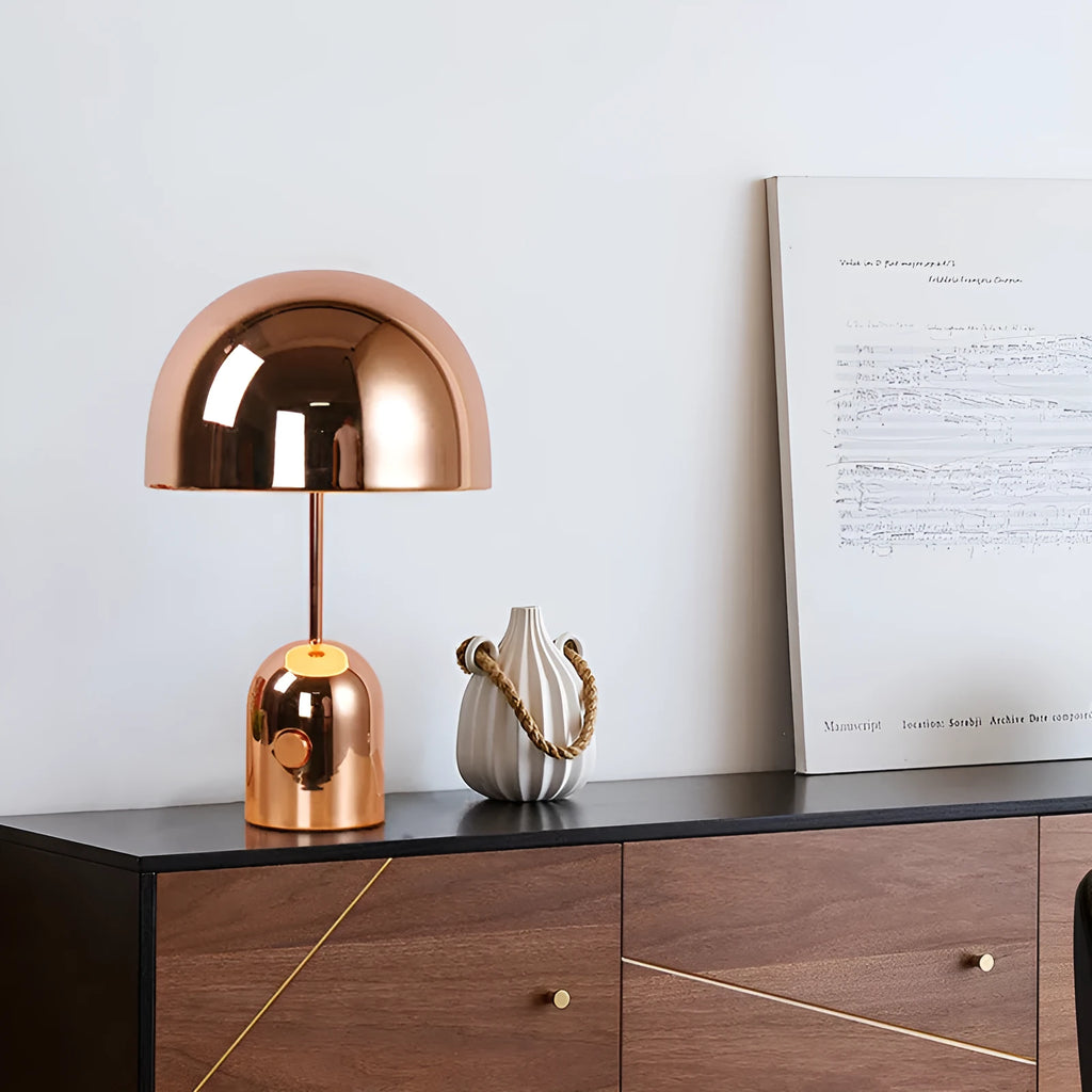 Mushroom-shaped table lamp with metal base in chrome, gold, or rose gold finish on wooden table