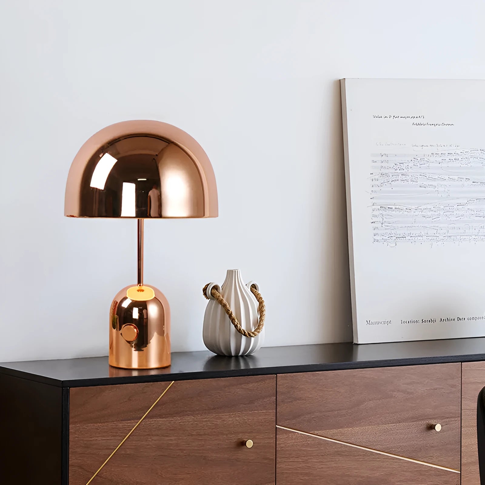 Mushroom-shaped table lamp with metal base in chrome, gold, or rose gold finish on wooden table