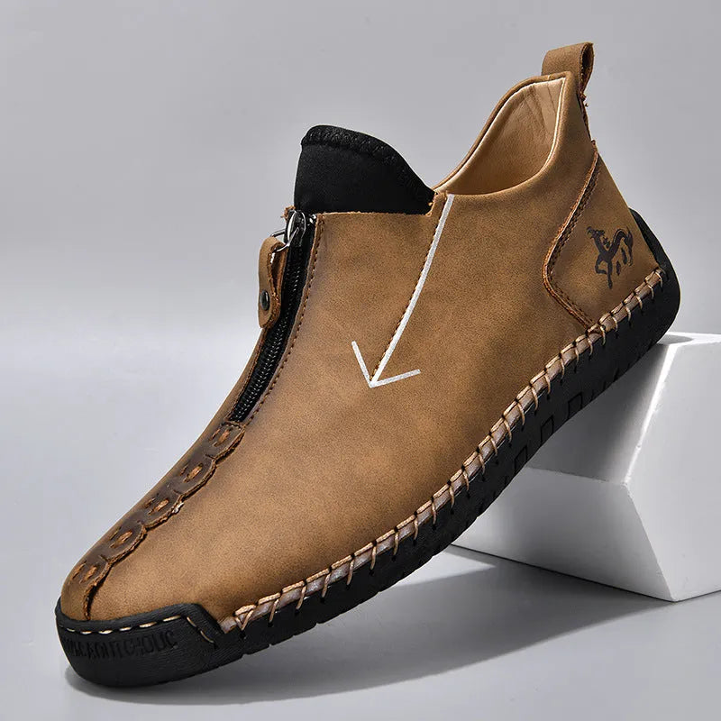 Men's black front zip Martin style boots with round toe and low rubber sole.