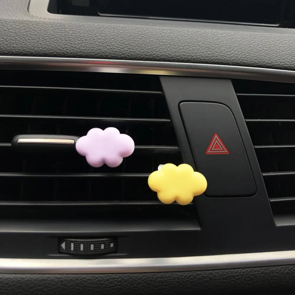 Baiyun cartoon resin car air vent fragrance clip in six colour options on a vent.