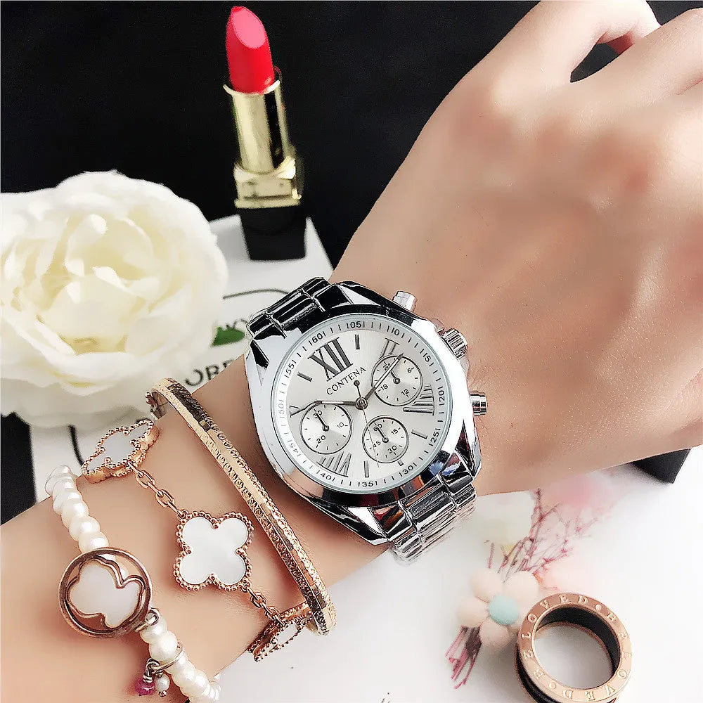 Women's silver rose gold diamond quartz watch with mesh strap, 15mm thick case.