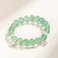 Green fluorite bracelet with star and moon princess designs on wrist