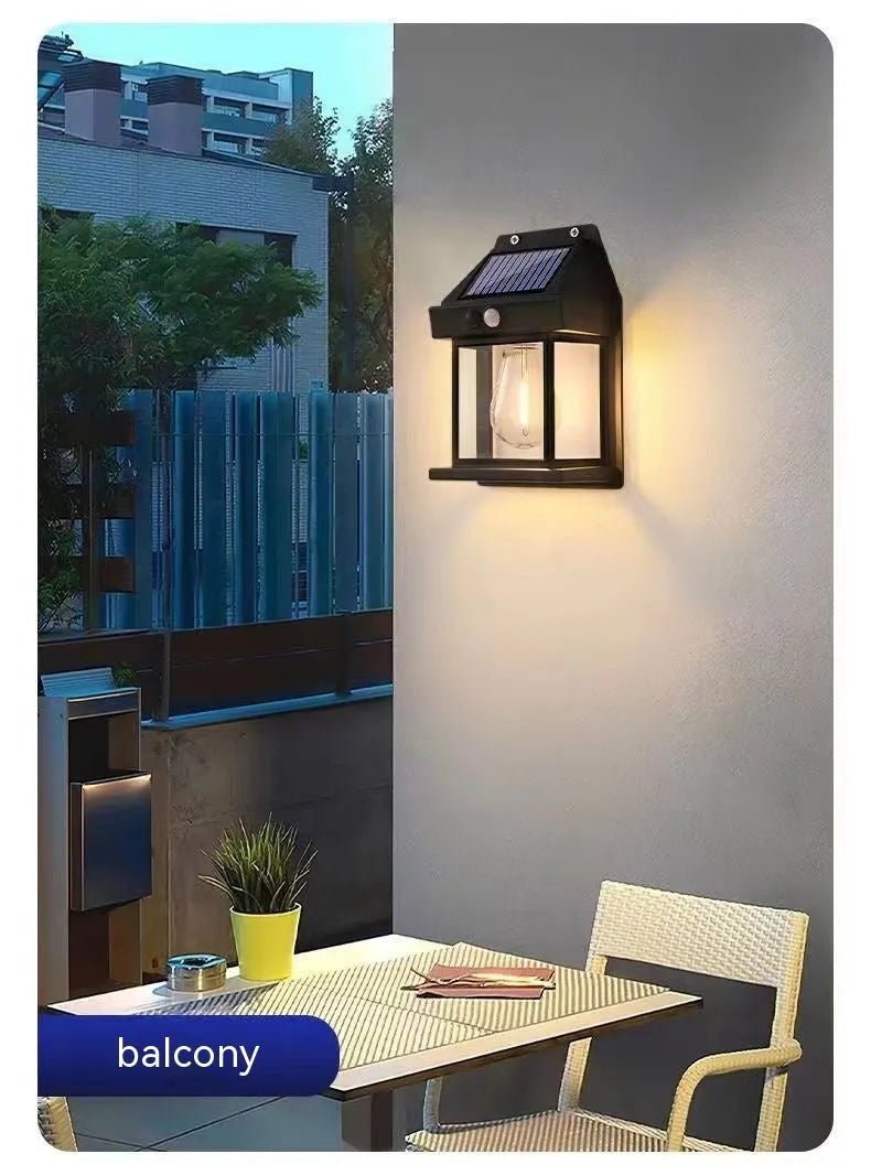 Solar tungsten wall lamp in black or white plastic with IP65 rating for outdoor garden and fence lighting