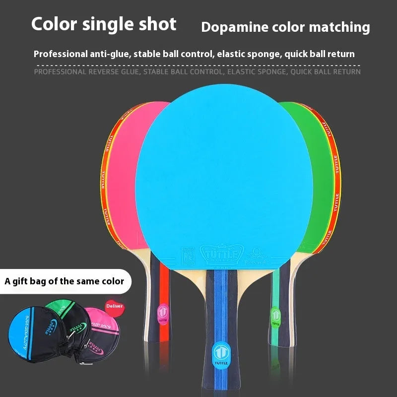 Blue, green, and pink professional table tennis rackets with long shakehand handles and matching carry bags.