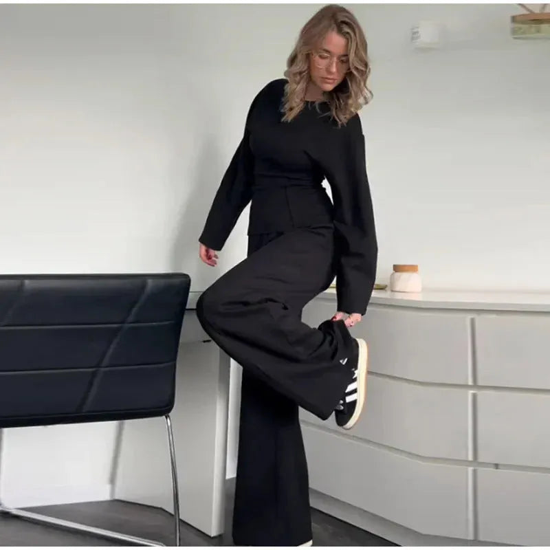 Women's long sleeve polar fleece suit set in apricot colour, showing O-neck top and wide-leg trousers.