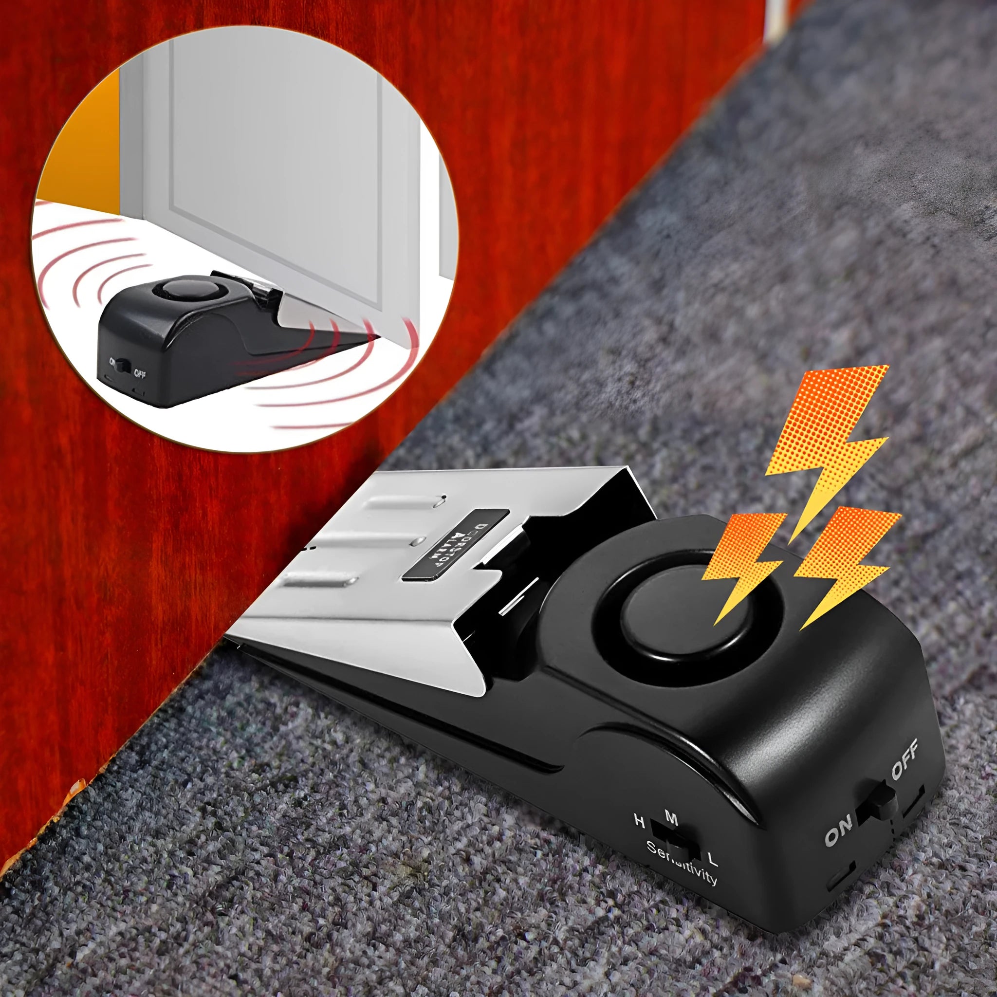 Black portable door stop alarm with wedge shape and stainless steel sensor cover.