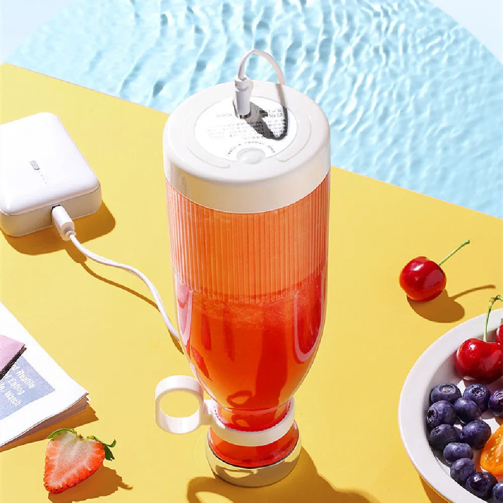 Portable USB juicing cup in blue with four cutter heads and plastic body