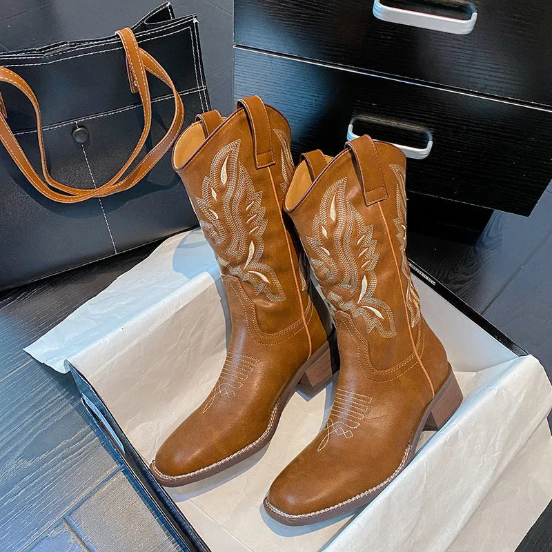 Brown women's mid-calf embroidered Martin boots with a leather lining and a low square heel.