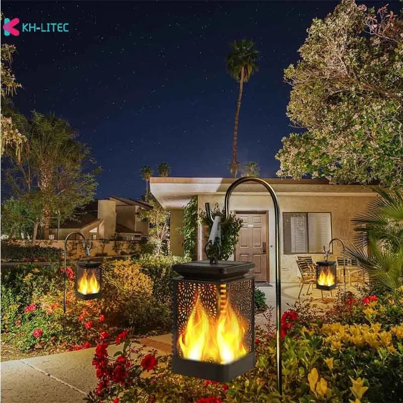 Set of four black solar-powered flame torch lights with flickering LED for outdoor garden decoration