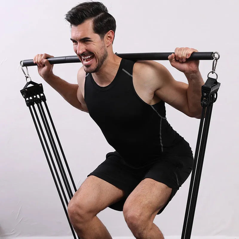 Stainless steel pilates stick with black EVA sponge grip and a silver bearing ring.