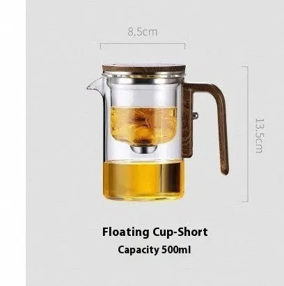Glass teapot with wooden handle showing magnetic separation button and inner filter basket.