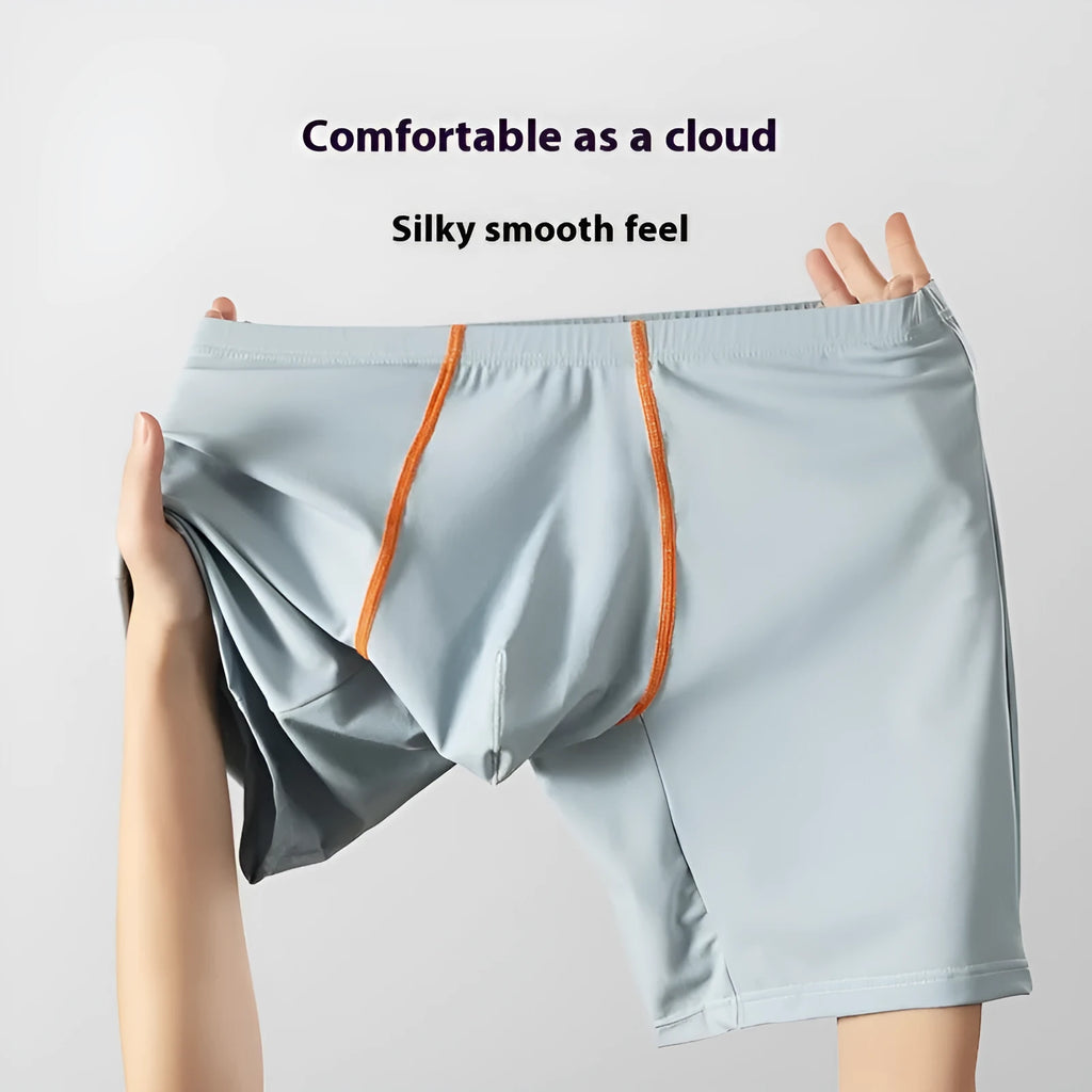 Men's mid-waist nylon boxer shorts in light green with a U-convex pouch, laid flat.