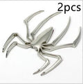 Three-dimensional zinc alloy spider emblem sticker in gold, measuring 7cm by 5cm.