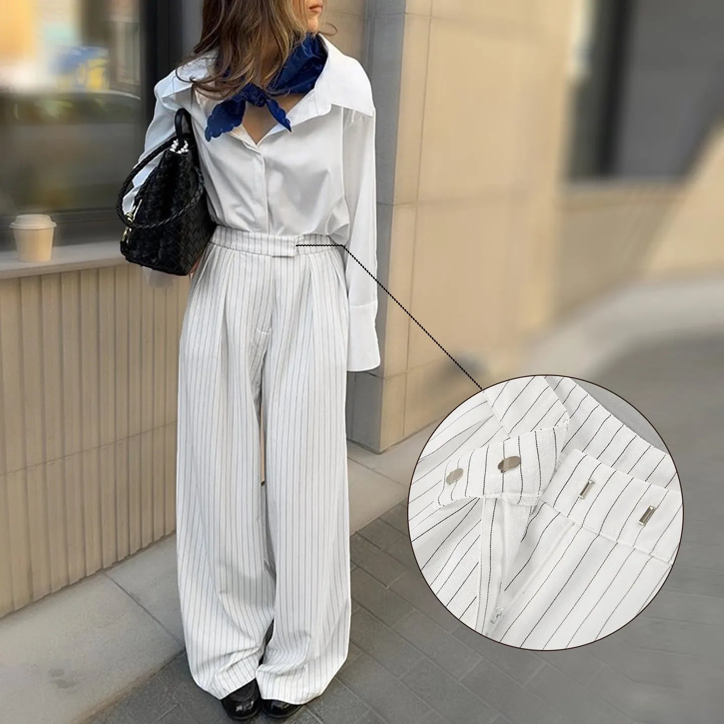 White striped wide-leg commuting trousers with zipper closure on mannequin