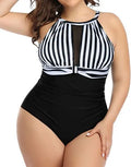 Women's black lace one-piece swimsuit on a mannequin, showing front design.