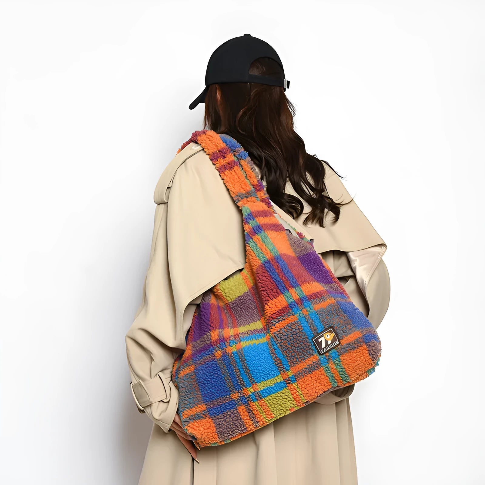 Women's plaid crossbody tote bag in soft plush fabric showing horizontal square shape and strapless shoulder strap