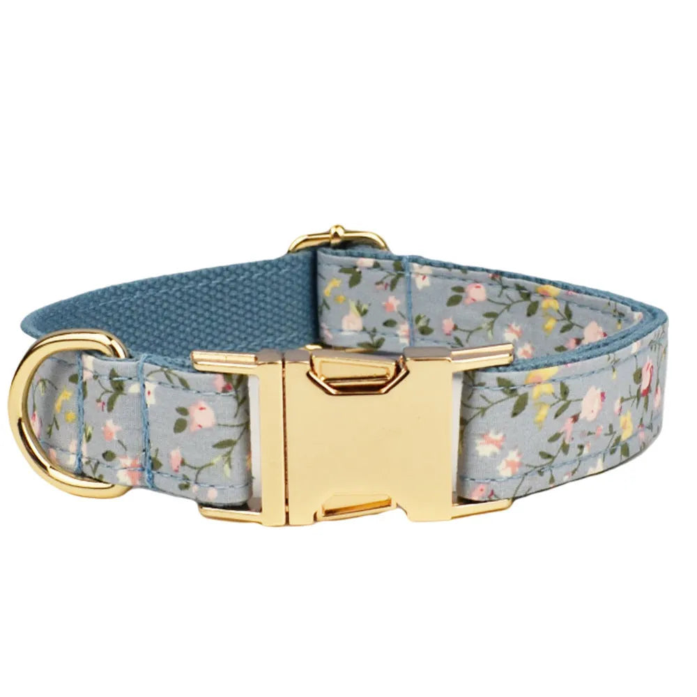 Blue floral polyester cotton dog collar with matching leash, vest, and bow tie accessories