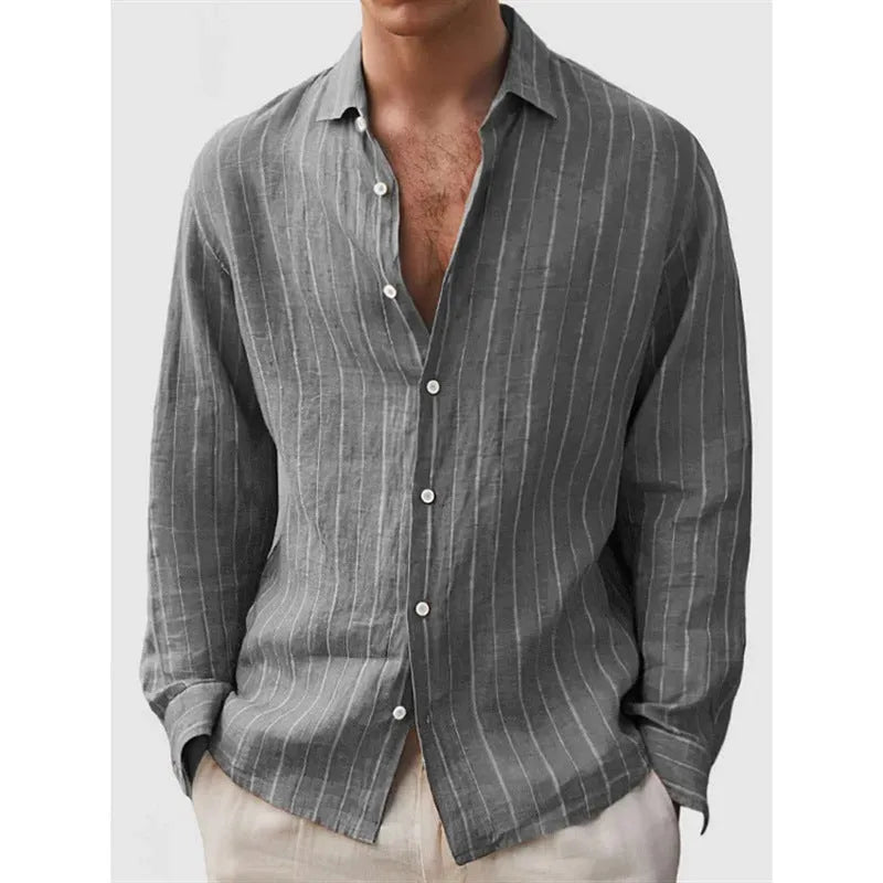 Man wearing a loose-fit striped long sleeve cardigan-style shirt in a casual setting.