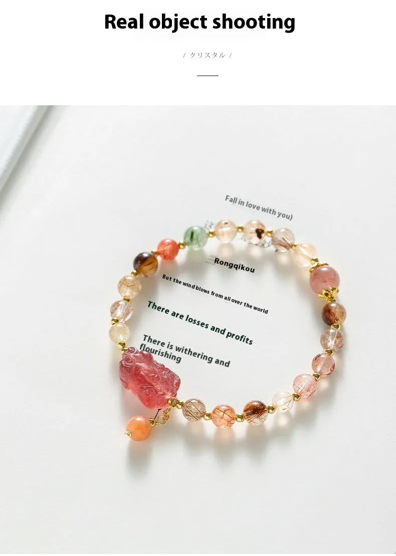 Women's strawberry quartz and copper bracelet with Pixiu charm, pearl, and dopamine crystals.