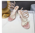 Women's rhinestone ankle-strap stiletto sandals with satin upper, round toe, and 10cm heel in silver colour
