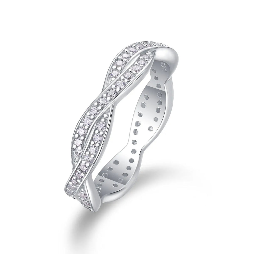 Moissanite wedding ring set in S925 silver with platinum plating on a white background