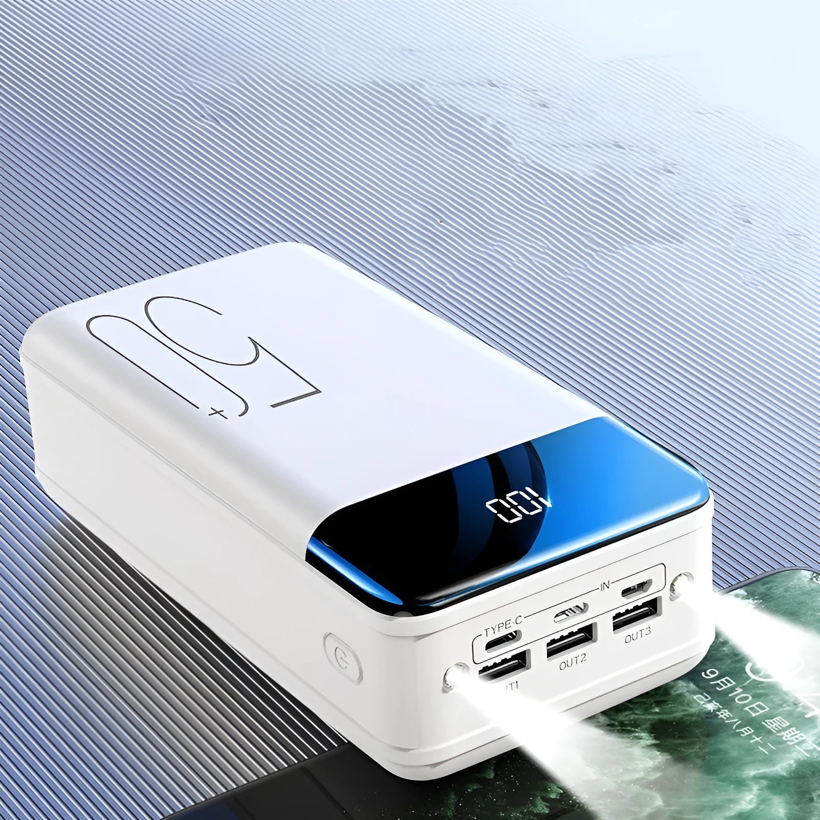 Large black and white 50000 mAh power bank showing three USB output ports